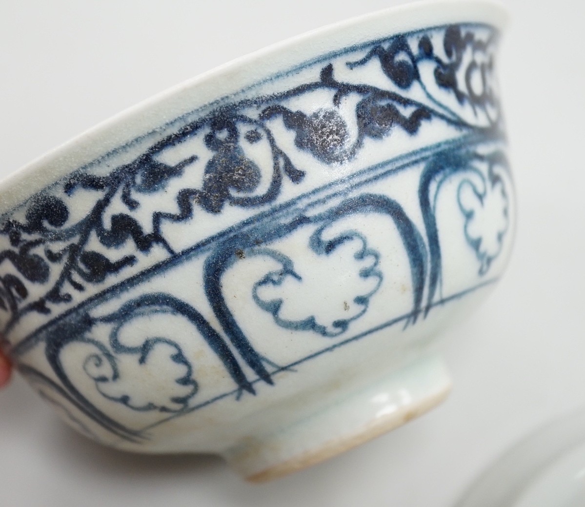 A small Chinese Ming blue and white bowl, and other, together with two small saucers (4)